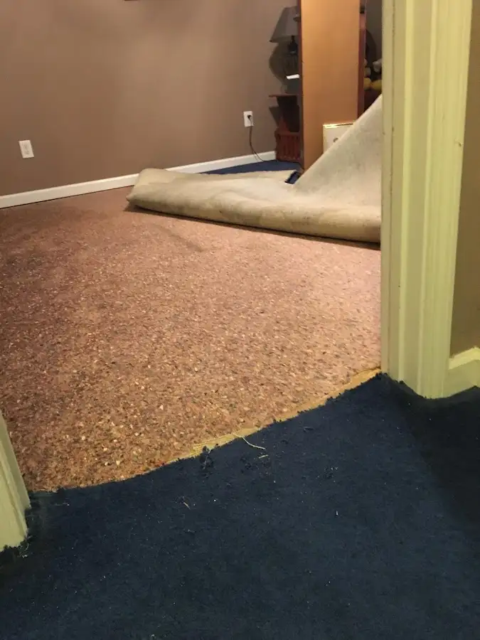 Carpet pad removal revealing water damage during Drying & Dehumidification in California