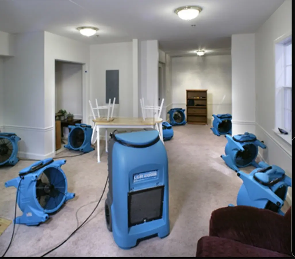Air movers and dehumidifier setup for Water Damage Restoration in California